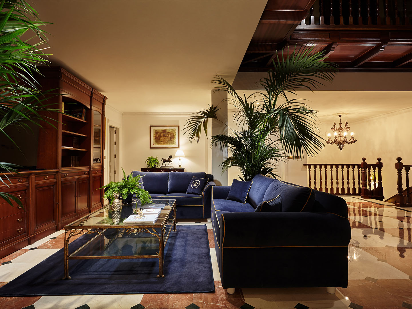 Elegant lobby with velvet sofas and chandeliers